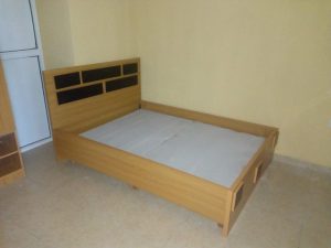 single brown wooded bed